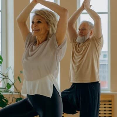 Man and woman doing yoga