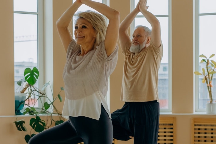 Man and woman doing yoga